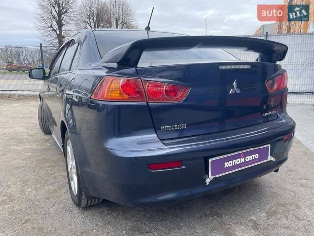 Синий Мицубиси Лансер, объемом двигателя 2 л и пробегом 142 тыс. км за 8000 $, фото 7 на Automoto.ua