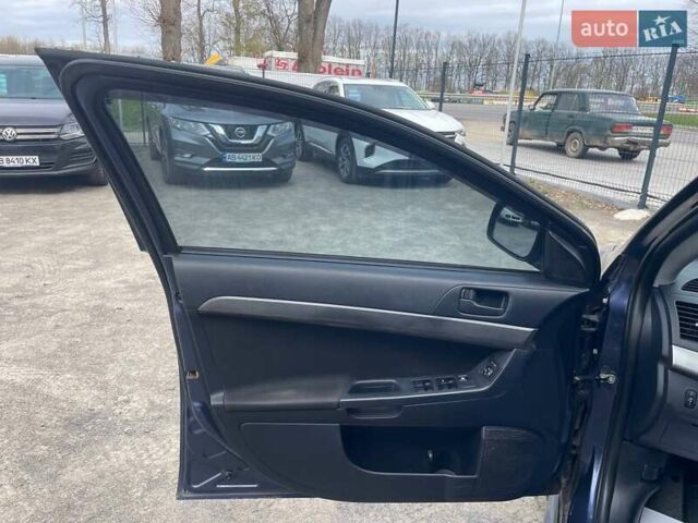 Синий Мицубиси Лансер, объемом двигателя 2 л и пробегом 142 тыс. км за 8000 $, фото 23 на Automoto.ua