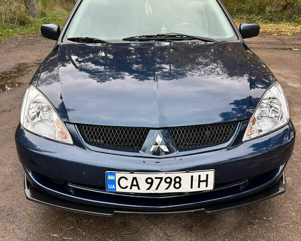 Синий Мицубиси Лансер, объемом двигателя 1.6 л и пробегом 150 тыс. км за 5700 $, фото 11 на Automoto.ua