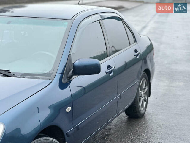 Синий Мицубиси Лансер, объемом двигателя 1.6 л и пробегом 187 тыс. км за 3799 $, фото 7 на Automoto.ua