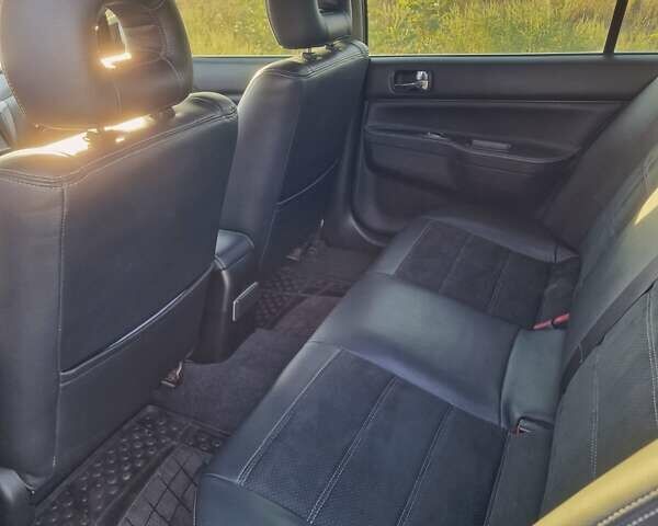 Синий Мицубиси Лансер, объемом двигателя 1.6 л и пробегом 197 тыс. км за 6500 $, фото 15 на Automoto.ua