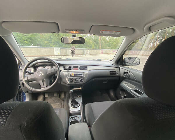 Синій Міцубісі Lancer, об'ємом двигуна 1.6 л та пробігом 206 тис. км за 5500 $, фото 9 на Automoto.ua