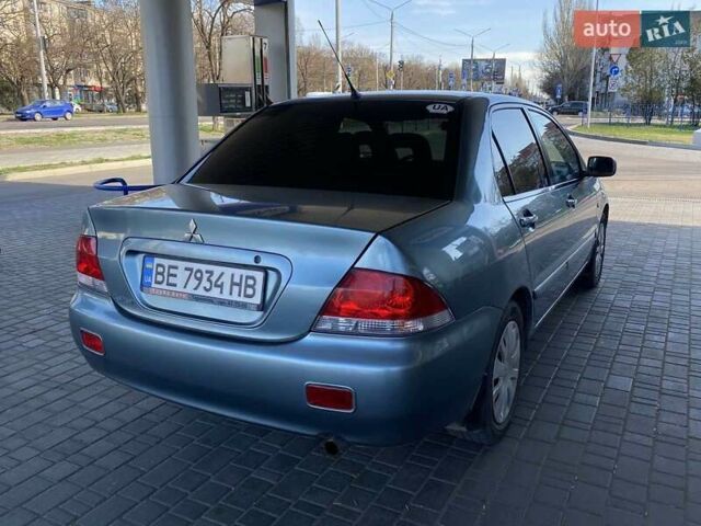 Синий Мицубиси Лансер, объемом двигателя 1.58 л и пробегом 166 тыс. км за 5500 $, фото 12 на Automoto.ua