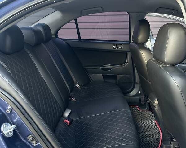 Синий Мицубиси Лансер, объемом двигателя 1.97 л и пробегом 260 тыс. км за 6000 $, фото 5 на Automoto.ua