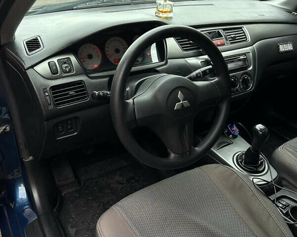 Синий Мицубиси Лансер, объемом двигателя 1.6 л и пробегом 150 тыс. км за 5700 $, фото 54 на Automoto.ua