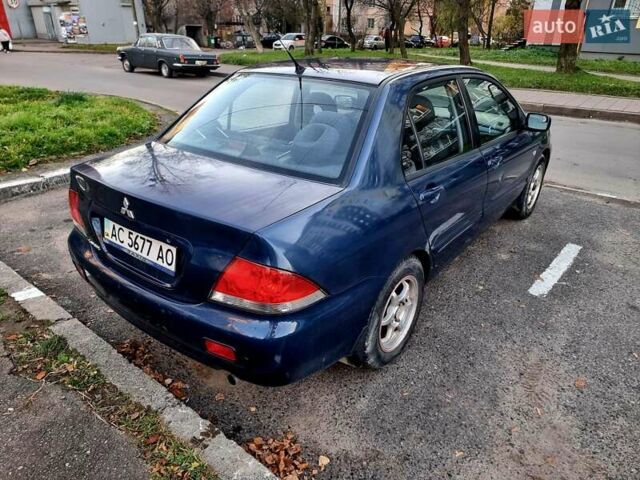 Синій Міцубісі Lancer, об'ємом двигуна 1.6 л та пробігом 298 тис. км за 2998 $, фото 4 на Automoto.ua