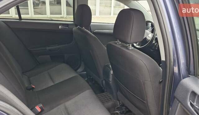 Синий Мицубиси Лансер, объемом двигателя 2 л и пробегом 186 тыс. км за 7200 $, фото 9 на Automoto.ua