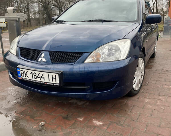 Синій Міцубісі Lancer, об'ємом двигуна 1.6 л та пробігом 225 тис. км за 5750 $, фото 4 на Automoto.ua