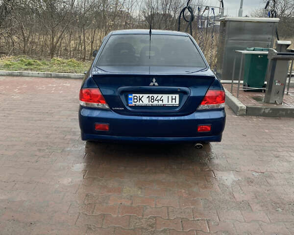 Синій Міцубісі Lancer, об'ємом двигуна 1.6 л та пробігом 225 тис. км за 5750 $, фото 13 на Automoto.ua