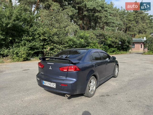 Синій Міцубісі Lancer, об'ємом двигуна 2 л та пробігом 299 тис. км за 7100 $, фото 4 на Automoto.ua