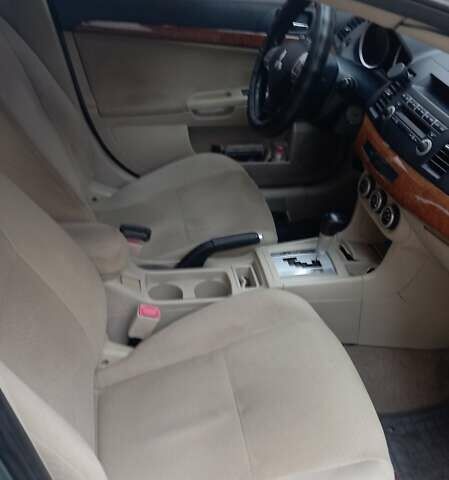 Синий Мицубиси Лансер, объемом двигателя 2 л и пробегом 300 тыс. км за 6900 $, фото 9 на Automoto.ua