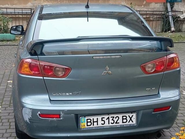 Синий Мицубиси Лансер, объемом двигателя 2 л и пробегом 300 тыс. км за 5600 $, фото 2 на Automoto.ua