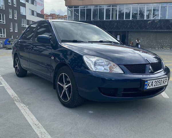 Синій Міцубісі Lancer, об'ємом двигуна 1.6 л та пробігом 206 тис. км за 5500 $, фото 1 на Automoto.ua