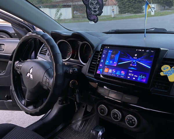 Синий Мицубиси Лансер, объемом двигателя 2 л и пробегом 280 тыс. км за 6900 $, фото 12 на Automoto.ua