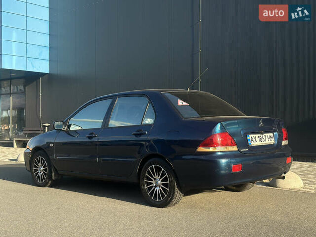 Синій Міцубісі Lancer, об'ємом двигуна 1.6 л та пробігом 191 тис. км за 3700 $, фото 9 на Automoto.ua