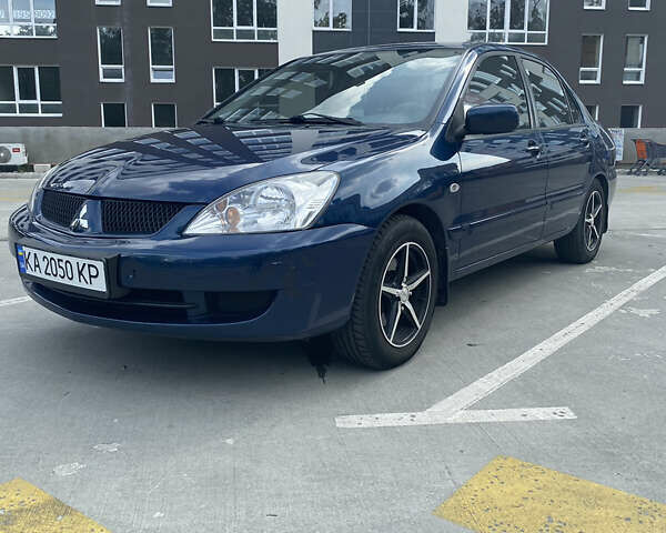 Синій Міцубісі Lancer, об'ємом двигуна 1.6 л та пробігом 206 тис. км за 5500 $, фото 3 на Automoto.ua