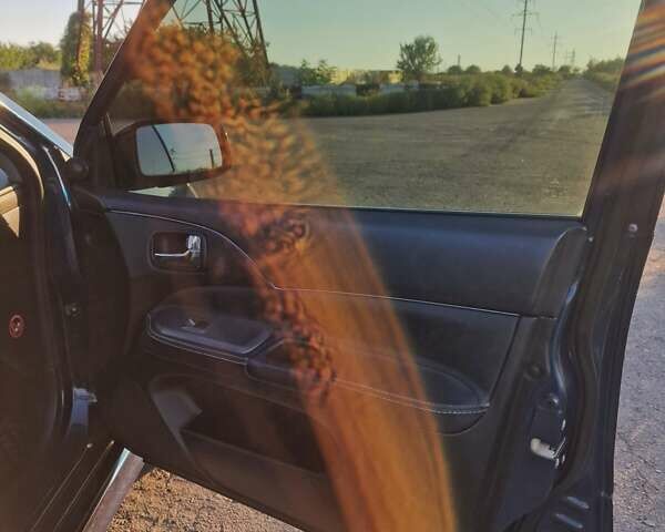 Синий Мицубиси Лансер, объемом двигателя 1.6 л и пробегом 197 тыс. км за 6500 $, фото 12 на Automoto.ua