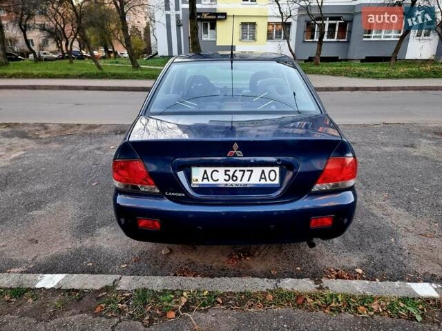 Синій Міцубісі Lancer, об'ємом двигуна 1.6 л та пробігом 298 тис. км за 2998 $, фото 7 на Automoto.ua