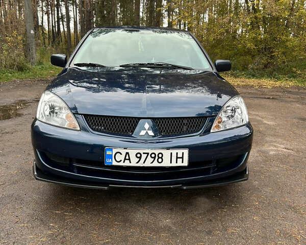 Синий Мицубиси Лансер, объемом двигателя 1.6 л и пробегом 150 тыс. км за 5700 $, фото 59 на Automoto.ua