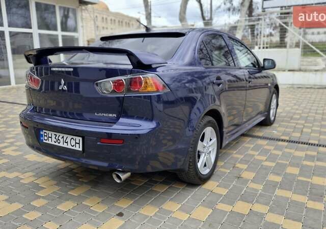 Синий Мицубиси Лансер, объемом двигателя 2 л и пробегом 186 тыс. км за 7200 $, фото 3 на Automoto.ua