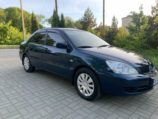 Синій Міцубісі Lancer, об'ємом двигуна 1.6 л та пробігом 200 тис. км за 4300 $, фото 7 на Automoto.ua