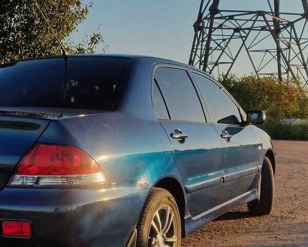Синий Мицубиси Лансер, объемом двигателя 1.6 л и пробегом 197 тыс. км за 6500 $, фото 4 на Automoto.ua