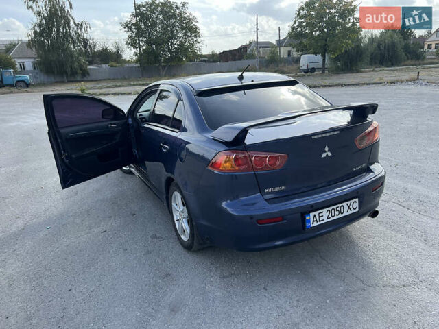 Синий Мицубиси Лансер, объемом двигателя 2 л и пробегом 248 тыс. км за 6600 $, фото 31 на Automoto.ua
