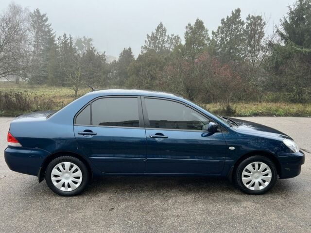 Синій Міцубісі Lancer, об'ємом двигуна 1.6 л та пробігом 126 тис. км за 5950 $, фото 7 на Automoto.ua