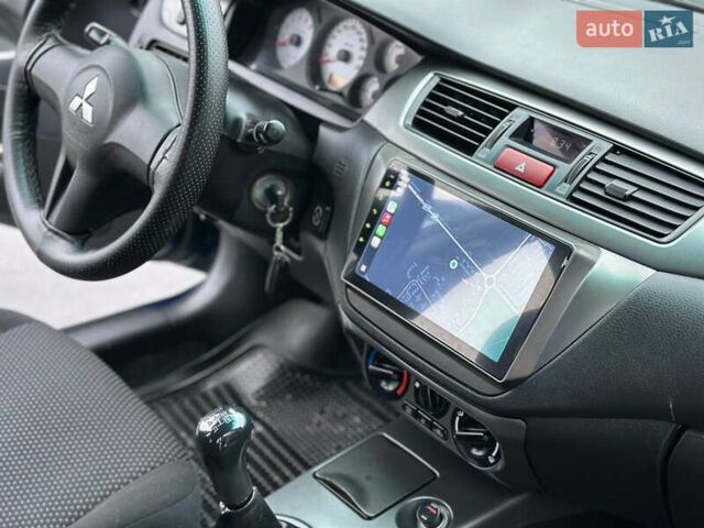 Синий Мицубиси Лансер, объемом двигателя 1.6 л и пробегом 187 тыс. км за 3799 $, фото 20 на Automoto.ua