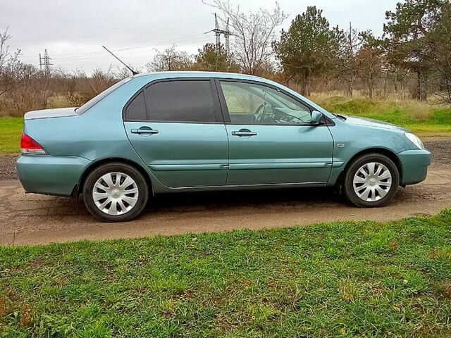 Синій Міцубісі Lancer, об'ємом двигуна 1.6 л та пробігом 167 тис. км за 4700 $, фото 6 на Automoto.ua