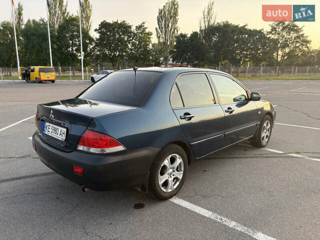 Синій Міцубісі Lancer, об'ємом двигуна 1.58 л та пробігом 167 тис. км за 5700 $, фото 6 на Automoto.ua