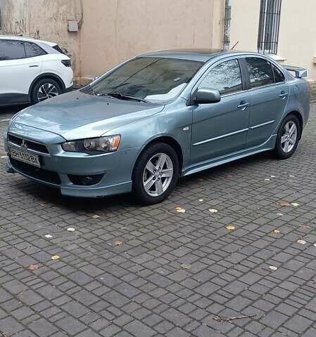 Синий Мицубиси Лансер, объемом двигателя 2 л и пробегом 300 тыс. км за 6900 $, фото 3 на Automoto.ua