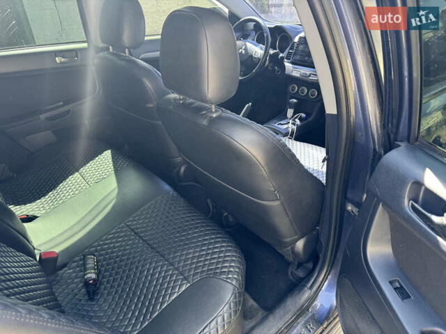 Синій Міцубісі Lancer, об'ємом двигуна 2 л та пробігом 299 тис. км за 7100 $, фото 10 на Automoto.ua