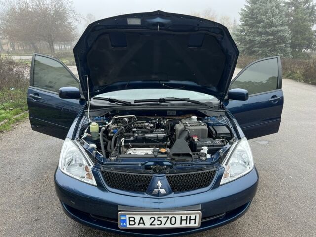 Синій Міцубісі Lancer, об'ємом двигуна 1.6 л та пробігом 126 тис. км за 5950 $, фото 8 на Automoto.ua