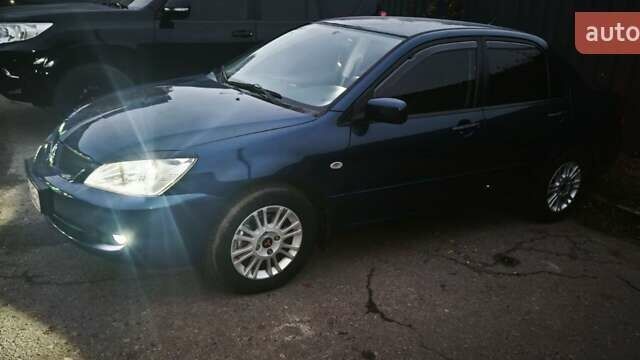 Синій Міцубісі Lancer, об'ємом двигуна 1.6 л та пробігом 206 тис. км за 5500 $, фото 13 на Automoto.ua
