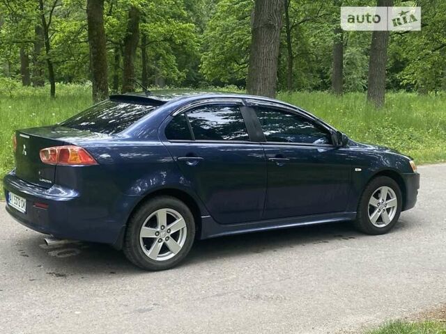 Синій Міцубісі Lancer, об'ємом двигуна 2 л та пробігом 130 тис. км за 7800 $, фото 3 на Automoto.ua