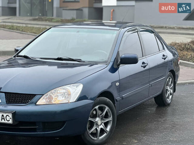 Синий Мицубиси Лансер, объемом двигателя 1.6 л и пробегом 187 тыс. км за 3799 $, фото 2 на Automoto.ua