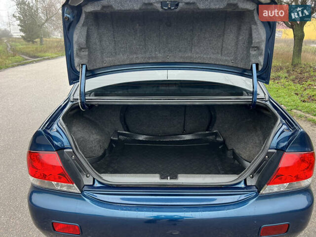 Синий Мицубиси Лансер, объемом двигателя 1.59 л и пробегом 126 тыс. км за 5950 $, фото 13 на Automoto.ua