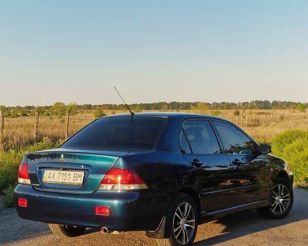 Синий Мицубиси Лансер, объемом двигателя 1.6 л и пробегом 197 тыс. км за 6500 $, фото 3 на Automoto.ua
