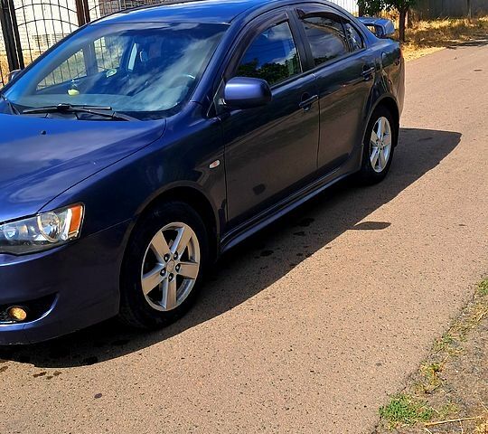 Синій Міцубісі Lancer, об'ємом двигуна 2 л та пробігом 242 тис. км за 5300 $, фото 2 на Automoto.ua