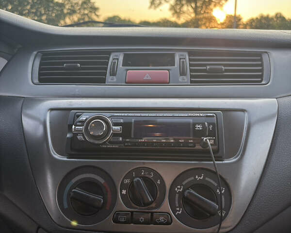Синій Міцубісі Lancer, об'ємом двигуна 1.58 л та пробігом 167 тис. км за 5700 $, фото 11 на Automoto.ua