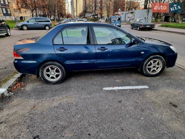 Синій Міцубісі Lancer, об'ємом двигуна 1.6 л та пробігом 298 тис. км за 2998 $, фото 8 на Automoto.ua