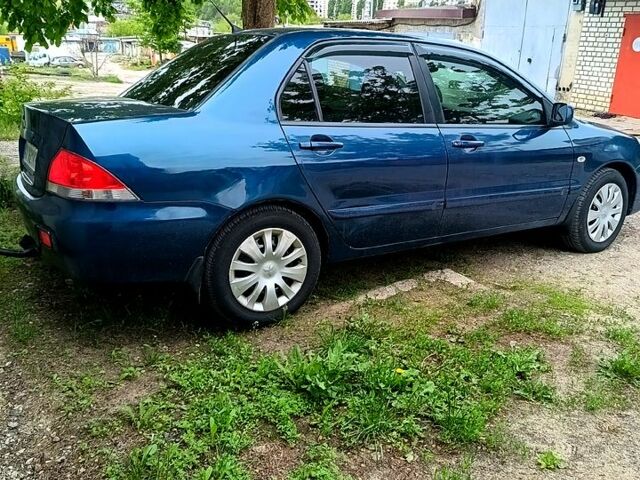 Міцубісі Lancer 2008 у Харкові на Automoto.ua Синій Міцубісі Lancer, об'ємом двигуна 1.6 л та пробігом 210 тис. км за 3700 $, фото 7 на Automoto.ua