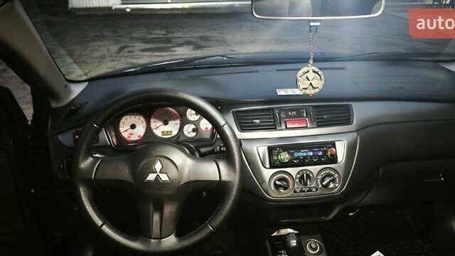 Синій Міцубісі Lancer, об'ємом двигуна 1.6 л та пробігом 206 тис. км за 5500 $, фото 12 на Automoto.ua