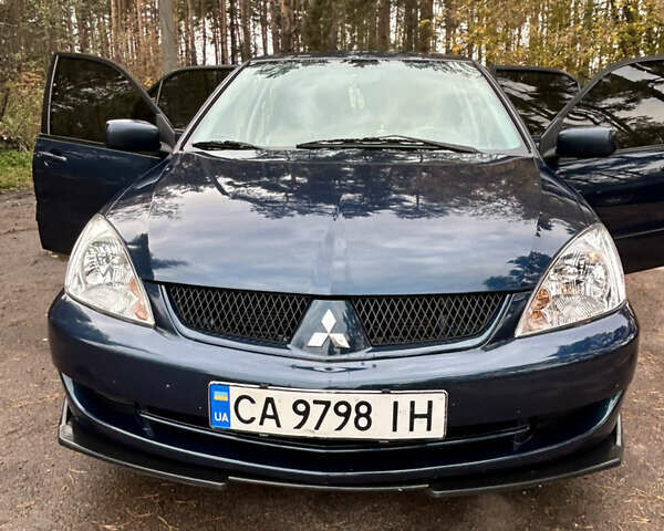 Синий Мицубиси Лансер, объемом двигателя 1.6 л и пробегом 150 тыс. км за 5700 $, фото 26 на Automoto.ua