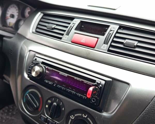 Синій Міцубісі Lancer, об'ємом двигуна 1.6 л та пробігом 206 тис. км за 5500 $, фото 2 на Automoto.ua