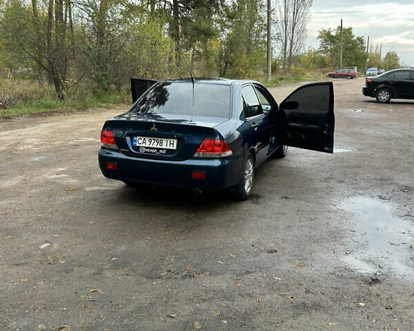 Синий Мицубиси Лансер, объемом двигателя 1.6 л и пробегом 150 тыс. км за 5700 $, фото 3 на Automoto.ua
