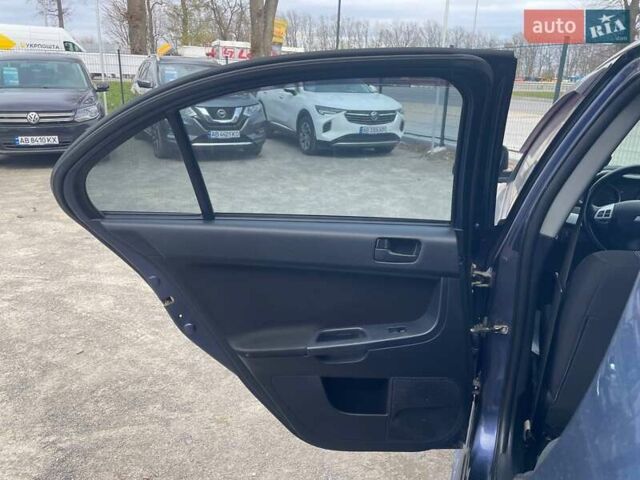 Синий Мицубиси Лансер, объемом двигателя 2 л и пробегом 142 тыс. км за 8000 $, фото 14 на Automoto.ua