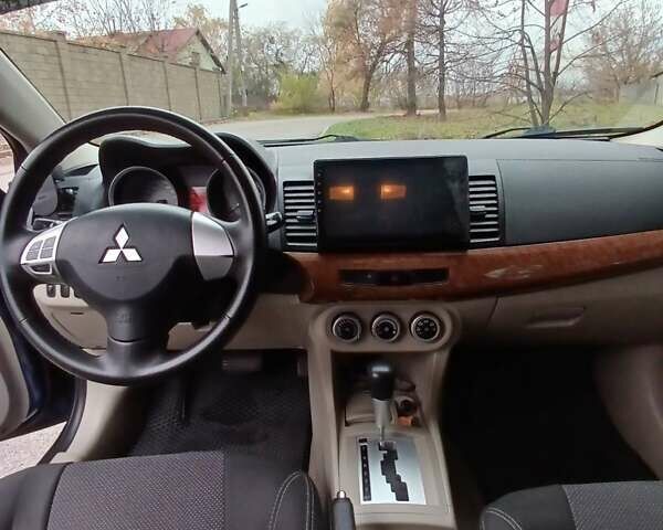 Синий Мицубиси Лансер, объемом двигателя 1.5 л и пробегом 220 тыс. км за 6999 $, фото 10 на Automoto.ua
