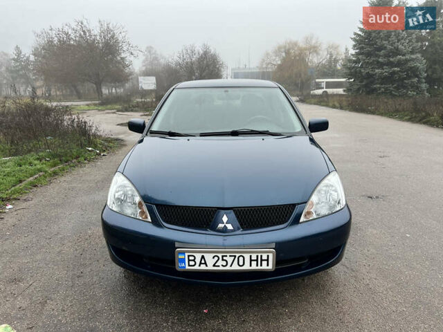 Синий Мицубиси Лансер, объемом двигателя 1.59 л и пробегом 126 тыс. км за 5950 $, фото 1 на Automoto.ua